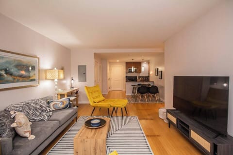 Living room with open floor plan flows into dining space 