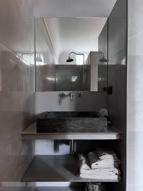 Private bathroom with shower and sink