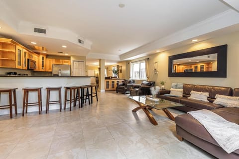 Open-concept living area connecting kitchen and lounge