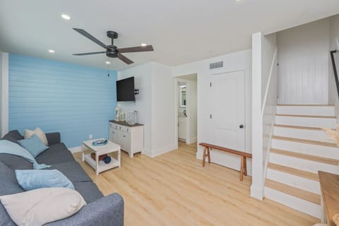 Spacious living area with a large sofa, perfect for lounging and relaxing.