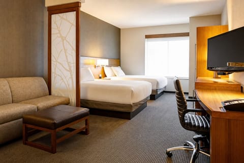 Wake up refreshed in a bright room with two plush beds.
