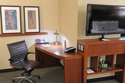 Work or unwind with an ergonomic desk and easy entertainment access.