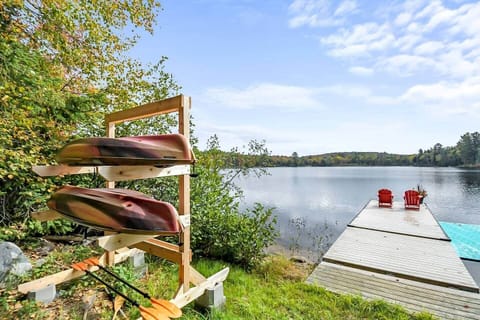 Lovely waterfront with docks, boats, floating mat - and all the paddles and life jackets.