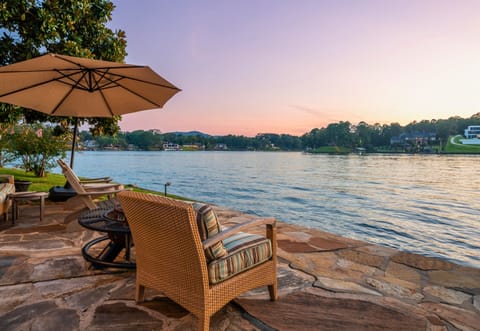Watch the sun dip below the horizon from your private waterfront patio.