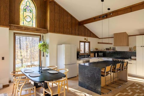 Our open concept dining room and kitchen, with enough seating for your whole group.