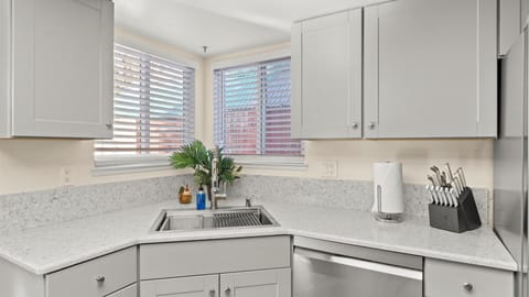 Well-appointed and efficient, the kitchen offers ample storage and counter space for comfortable, extended stays