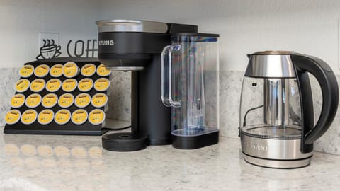 The kitchen coffee station includes a Keurig, electric kettle, and a variety of pods—making mornings easy and convenient during your stay