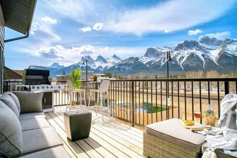 Large Balcony with a BBQ, Pub table, and Lounge set on the upper floor