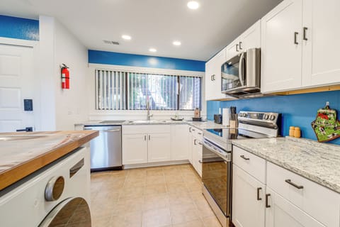 1st-floor kitchen fully equipped w/ a dishwasher, electric stove & microwave