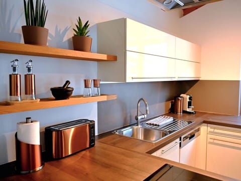 Furniture, Kitchen, Interior Design, Wood, Countertop, Cabinetry, Flooring, Home, Kitchen Appliance, Lighting