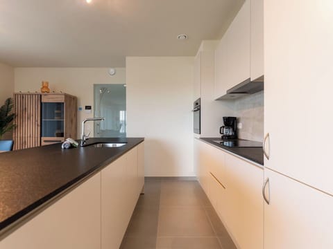 Kitchen, Countertop, Interior Design, Flooring, Wood, Floor, Cabinetry, Ceiling, Light Fixture, Kitchen Appliance