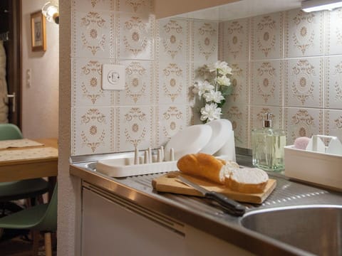 Flooring, Interior Design, Floor, Ceiling, Tile, Kitchen, Countertop, Cabinetry, Sink, Plumbing