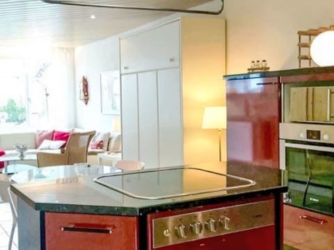 Furniture, Interior Design, Flooring, Kitchen, Kitchen Appliance, Countertop, Floor, Wood, Ceiling, Major Appliance