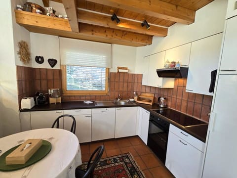 Kitchen, Countertop, Kitchen Appliance, Cabinetry, Interior Design, Furniture, Flooring, Wood, Major Appliance, Ceiling