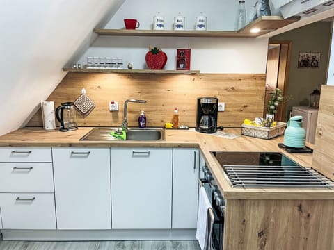 Wood, Kitchen, Flooring, Countertop, Interior Design, Kitchen Appliance, Major Appliance, Furniture, Cabinetry, Home Appliance