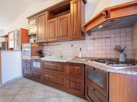 Kitchen, Wood, Interior Design, Cabinetry, Flooring, Countertop, Major Appliance, Floor, Kitchen Appliance, Cupboard
