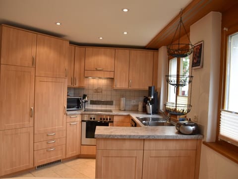 Furniture, Cabinetry, Kitchen, Countertop, Kitchen Appliance, Flooring, Wood, Interior Design, Major Appliance, Cupboard