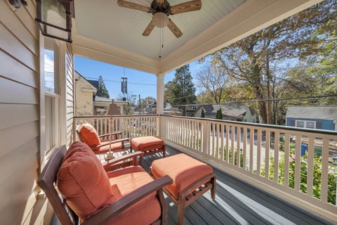 Sunny covered porch w/ cushioned seating, perfect for slow mornings outdoors