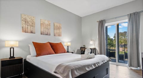 Tree art, warm lamps, and a queen bed that’s basically a five-star nap trap.