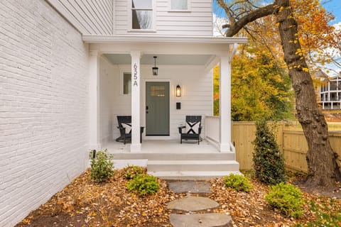 Charming front porch with Adirondack chairs