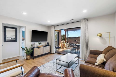 Curl up in the chic living room & enjoy a movie night at home​