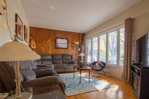 Bright living room – large windows and cozy seating area