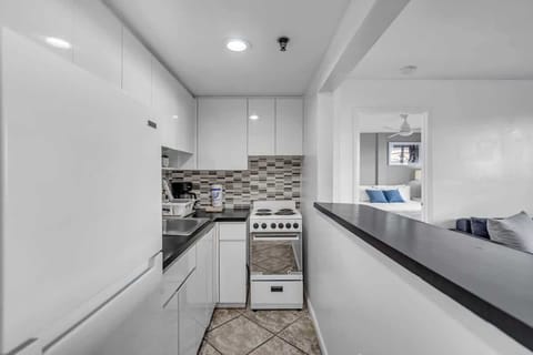 Cook up comfort in this efficient Airbnb kitchen—modern appliances, sleek design, and everything you need for your stay.
