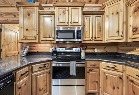 Stainless steel finishes and plenty of workspace make this kitchen a practical and welcoming spot for whipping up meals.