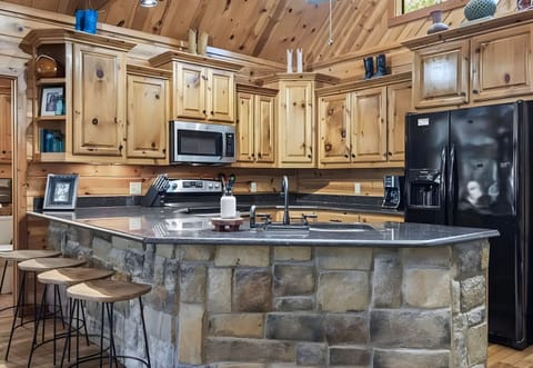 With warm wood cabinetry and updated appliances, this kitchen blends rustic charm with all the conveniences you expect.
