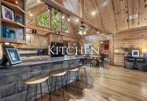 Meal prep feels easy in this roomy kitchen, complete with generous counter space and bar seating for chatting while you cook.