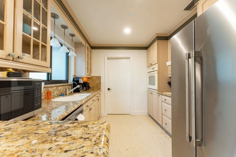 Granite countertops and plenty of space for prepping meals or snacks.