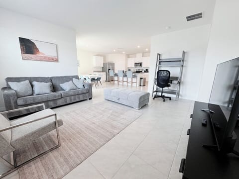 Spacious, sun-lit living room.