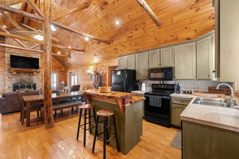 Bright open kitchen that connects to the dining and living areas.
