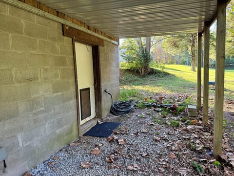 Back door located downstairs to covered outdoor area