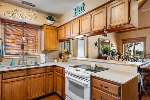 Kitchen | Overlooking Dining Area and Living Room with Tree Views