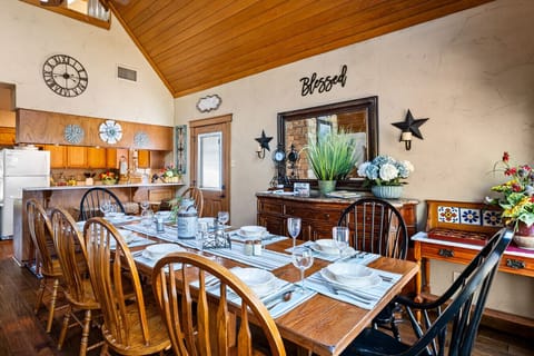 Dining Area | Open-Concept Space with Stone Fireplace and Rustic Charm