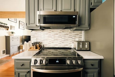 Open kitchen with all stainless-steel appliances