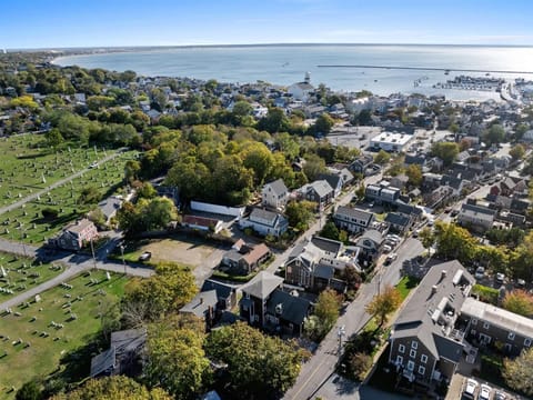 A stunning aerial view of this Provincetown vacation rental overlooking the harbor and downtown. You can see MacMillan Pier and bustling Commercial Street just moments away.