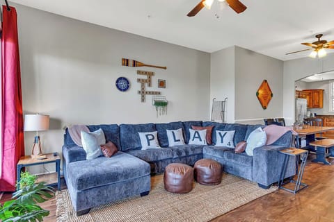 Spacious living area with fireplace, Smart TV, comfy sofa, and ALL the games!
