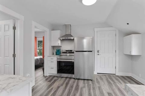 Kitchen features stainless steel appliances with a glass stop stove and a coffee bar. The twin bedroom is off the kitchen along with the bathroom.