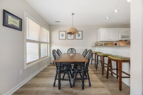 Gather for meals in this light-filled dining area just off the kitchen.