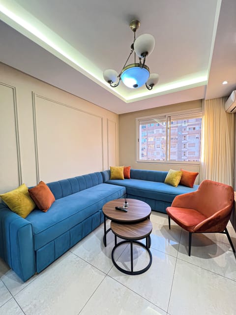 Cozy lounge with Smart TV, soft sofa, and gentle lighting for family nights