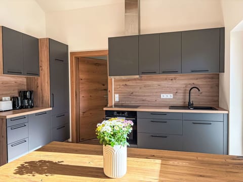 Furniture, Flooring, Interior Design, Wood, Floor, Kitchen & Dining Room Table, Cabinetry, Table, Countertop, Kitchen