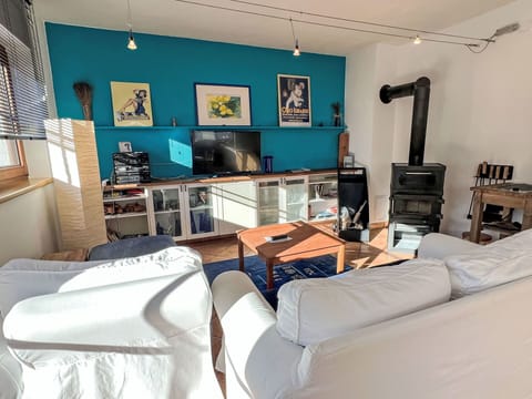 Furniture, Interior Design, Flooring, Wood, Floor, Room, Lighting, Living Room, Television, Ceiling