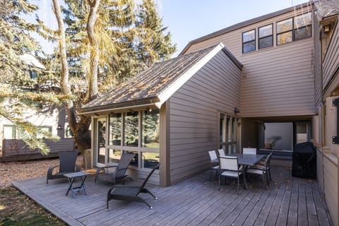 Spacious private deck with outdoor seating and dining area—perfect for morning coffee, fresh mountain air, or relaxing after a day of adventure.