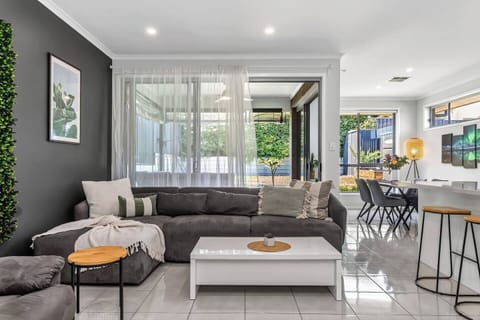 The open layout creates an easy flow between living, dining and kitchen spaces, encouraging relaxed connection throughout your stay.