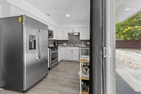 Contemporary kitchen with direct access to the outdoor patio.