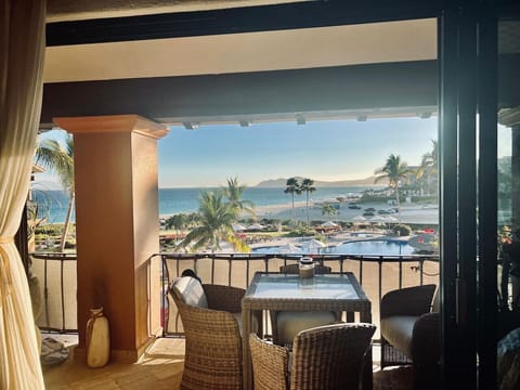 Wake up to stunning views of the pool, palm trees, and the ocean right from the comfort of your bed.