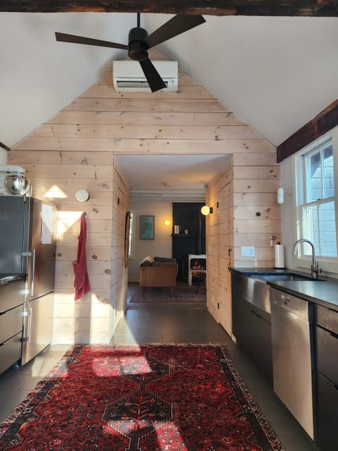 View from kitchen into the living room with mini split.