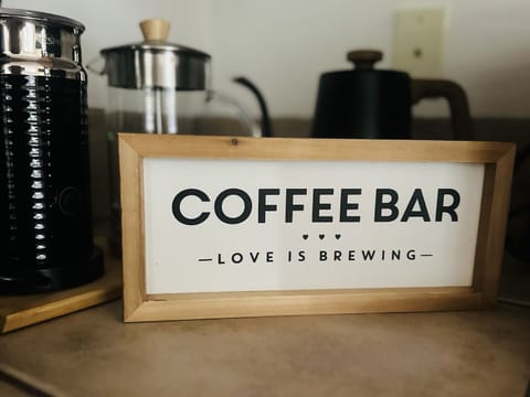 Fully stocked coffee bar featuring local coffee beans and Nespresso machine